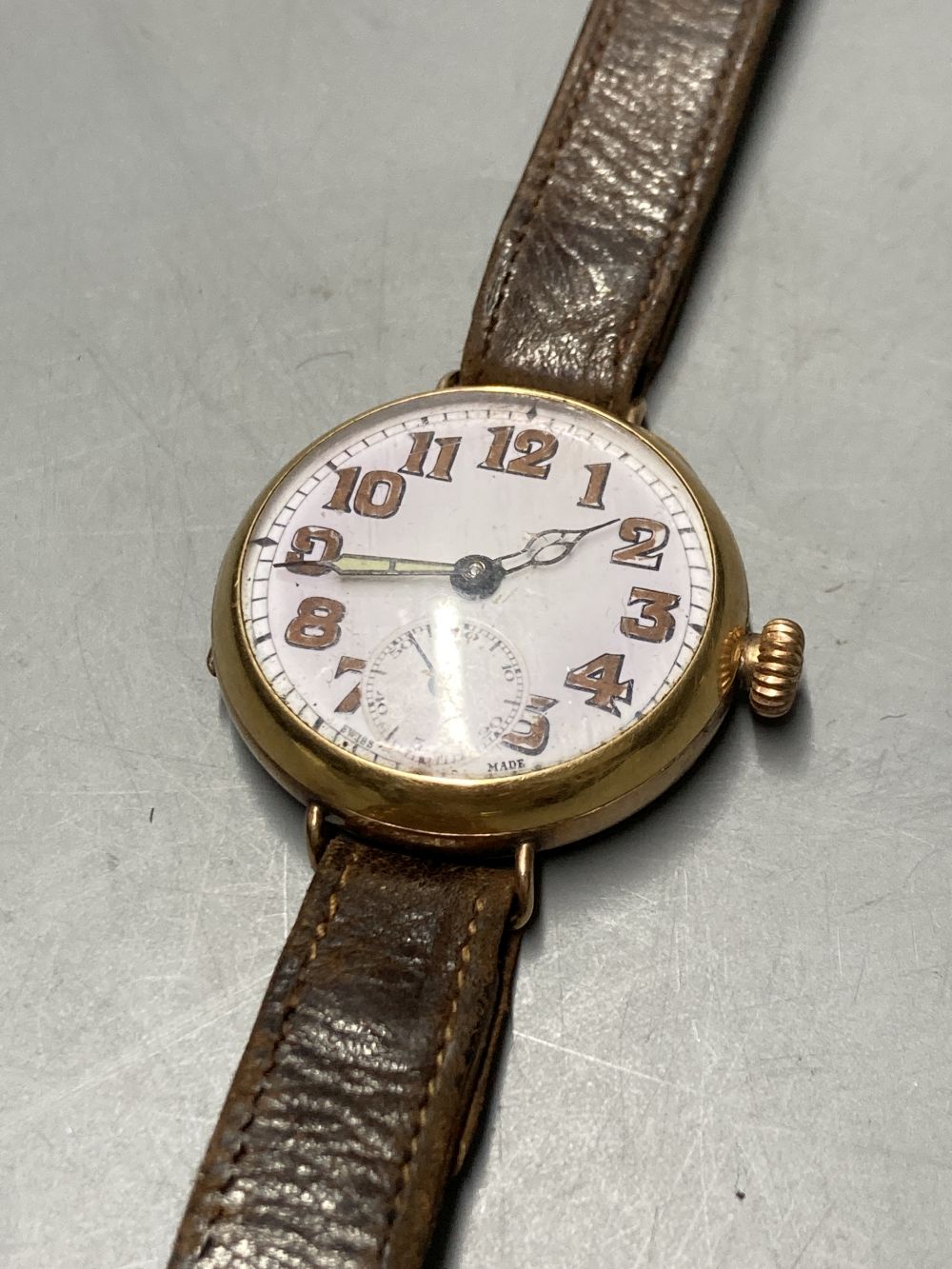 A 9ct gold vintage wristwatch with circular dial and subsidiary seconds dial (converted) and three other 9ct gold watches,